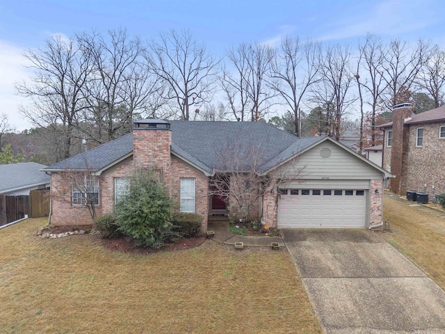 single story home with a garage and a front yard