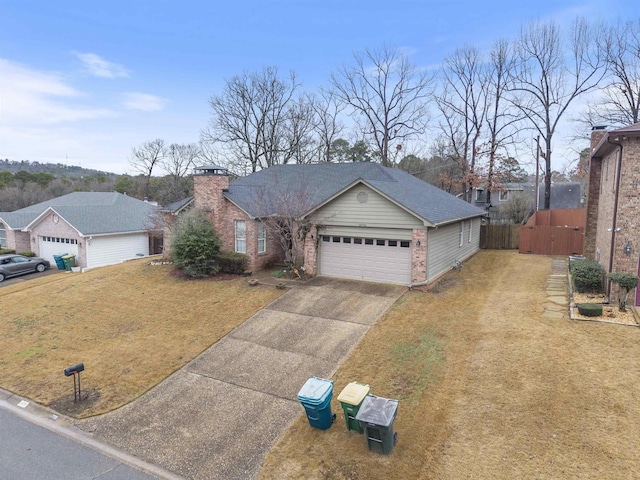 single story home featuring a garage and a front yard