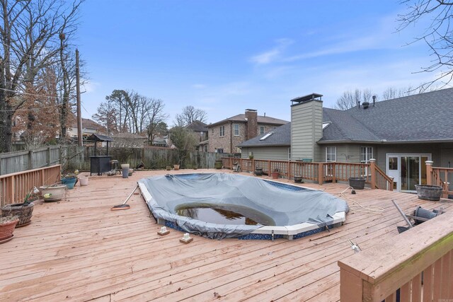 wooden terrace featuring a covered pool