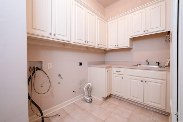 laundry area with gas dryer hookup, sink, cabinets, washer hookup, and electric dryer hookup