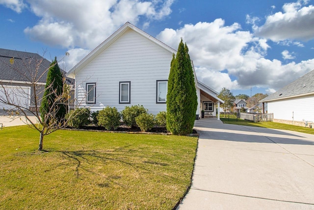 view of property exterior with a yard