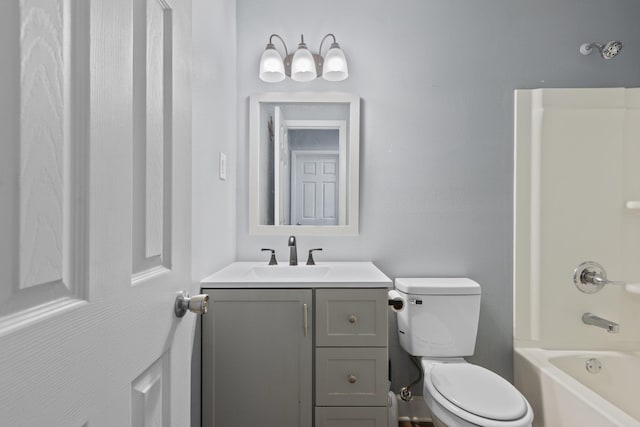 full bathroom with vanity, toilet, and washtub / shower combination