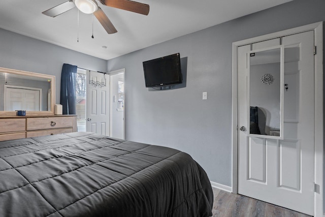 bedroom with ceiling fan and dark hardwood / wood-style flooring