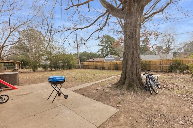 view of yard with a patio area and central air condition unit