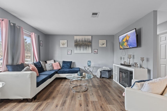 living room with dark wood-type flooring