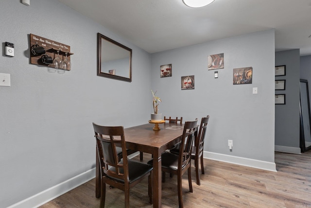 dining room featuring hardwood / wood-style flooring