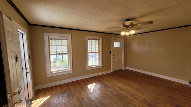 entrance foyer featuring ornamental molding, dark hardwood / wood-style floors, and ceiling fan