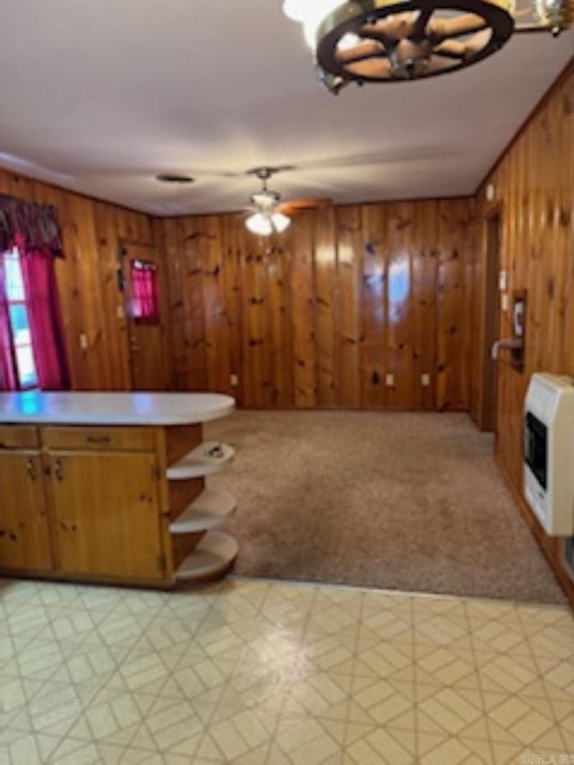 1985 Old Wire Rd, Camden, AR 71701 - interior space featuring heating unit, light carpet, wood walls, and light floors