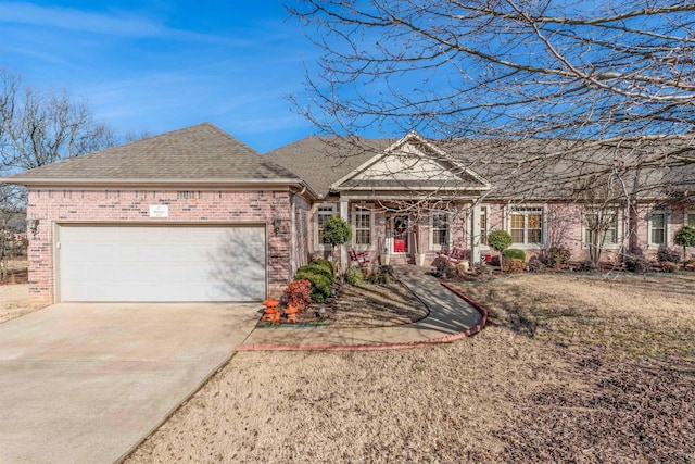 view of front of home featuring a garage and a front yard