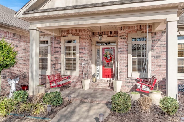 doorway to property featuring covered porch