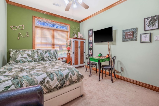 carpeted bedroom featuring crown molding and ceiling fan