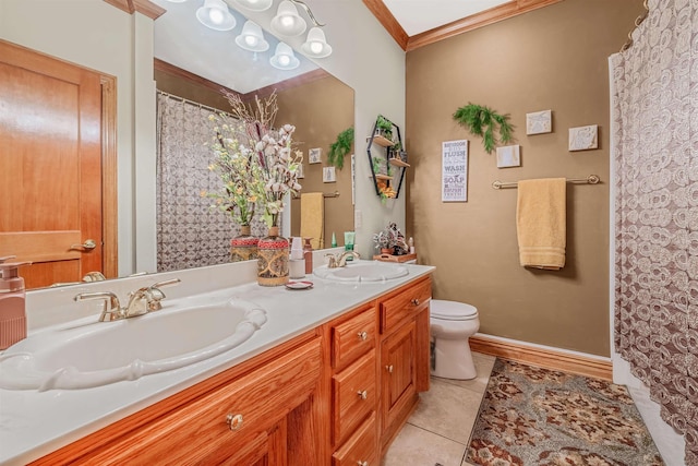 bathroom with tile patterned flooring, crown molding, vanity, and toilet