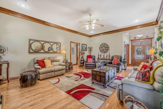 living room featuring ornamental molding, ceiling fan, and light hardwood / wood-style floors