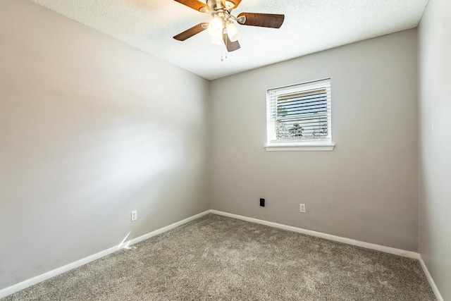 carpeted spare room with ceiling fan and a textured ceiling