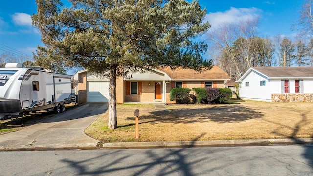 single story home with a garage and a front yard