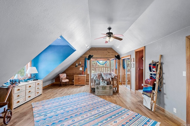 140 Vineyard Dr, Searcy, AR 72143 - bedroom with ceiling fan, lofted ceiling, a textured ceiling, and light hardwood / wood-style floors