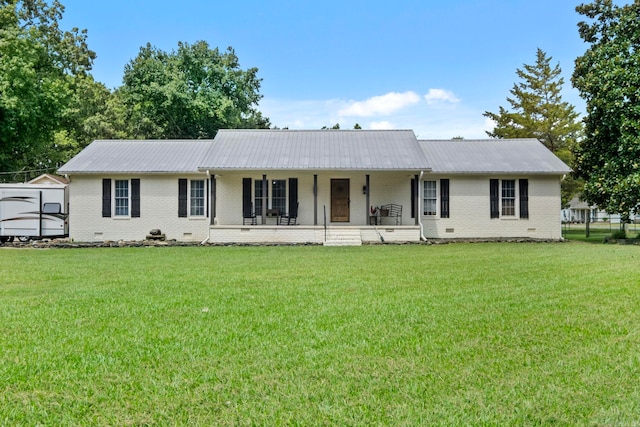 single story home featuring covered porch and a front yard