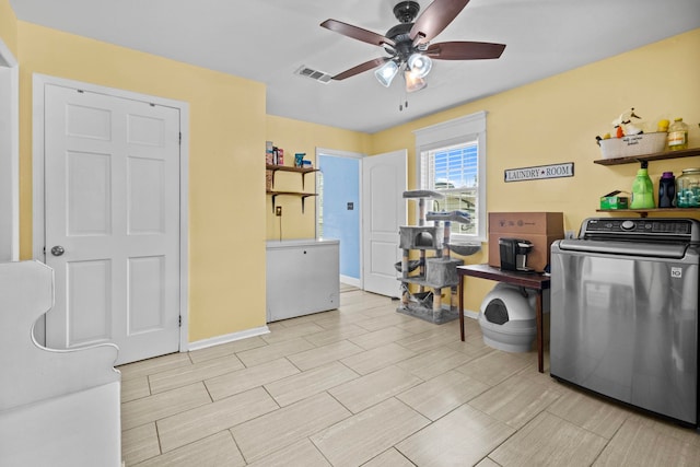 kitchen with washer / clothes dryer and ceiling fan