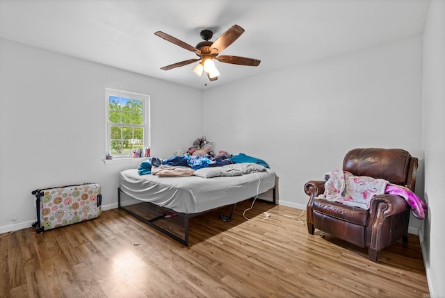 bedroom with ceiling fan and light wood-type flooring