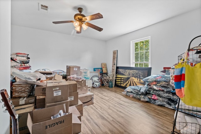 interior space with hardwood / wood-style flooring and ceiling fan