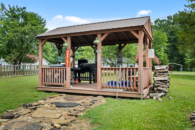 wooden deck with a yard and a gazebo