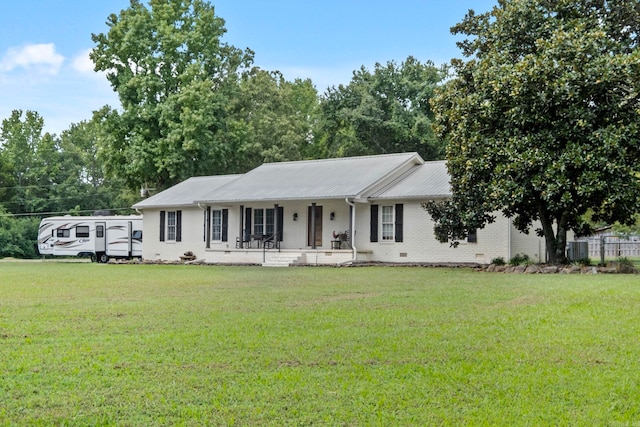 ranch-style house featuring a porch and a front yard