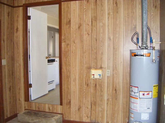 utility room featuring water heater