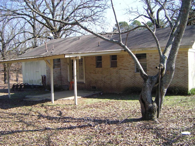 back of house with a patio