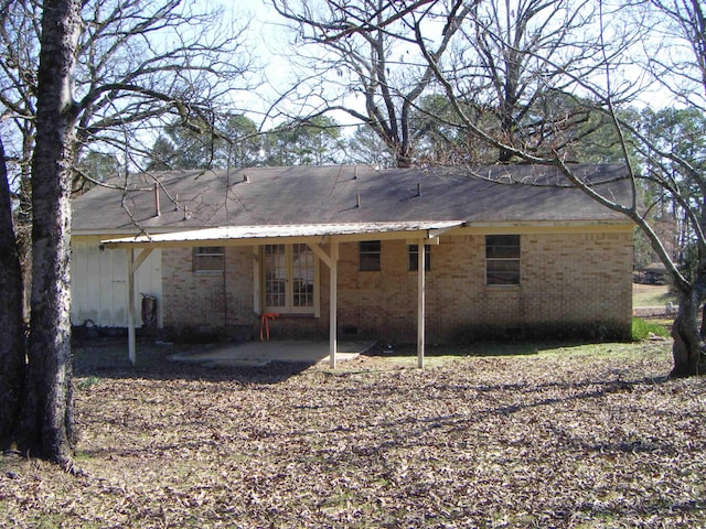 rear view of house featuring french doors and a patio area