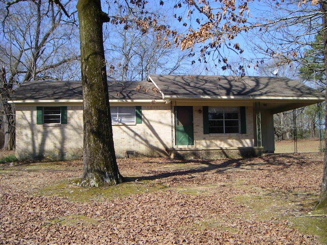 view of side of property featuring a carport