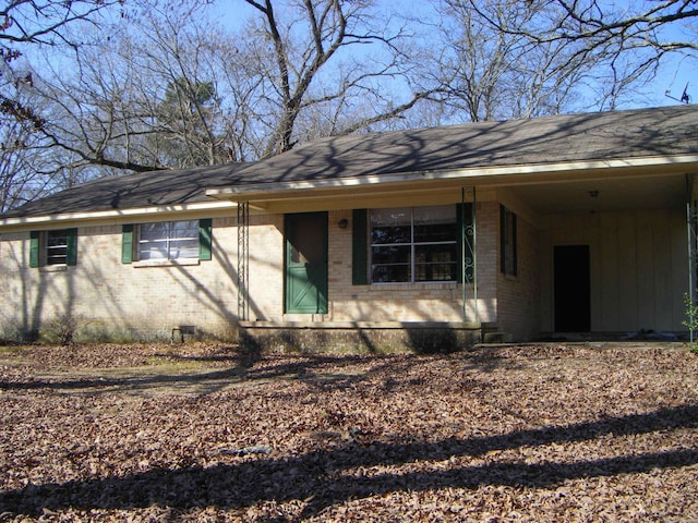 exterior space with a carport