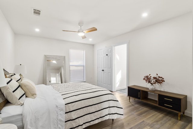 bedroom with dark wood-type flooring and ceiling fan