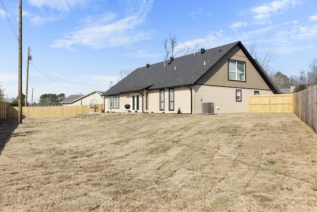 back of house featuring cooling unit