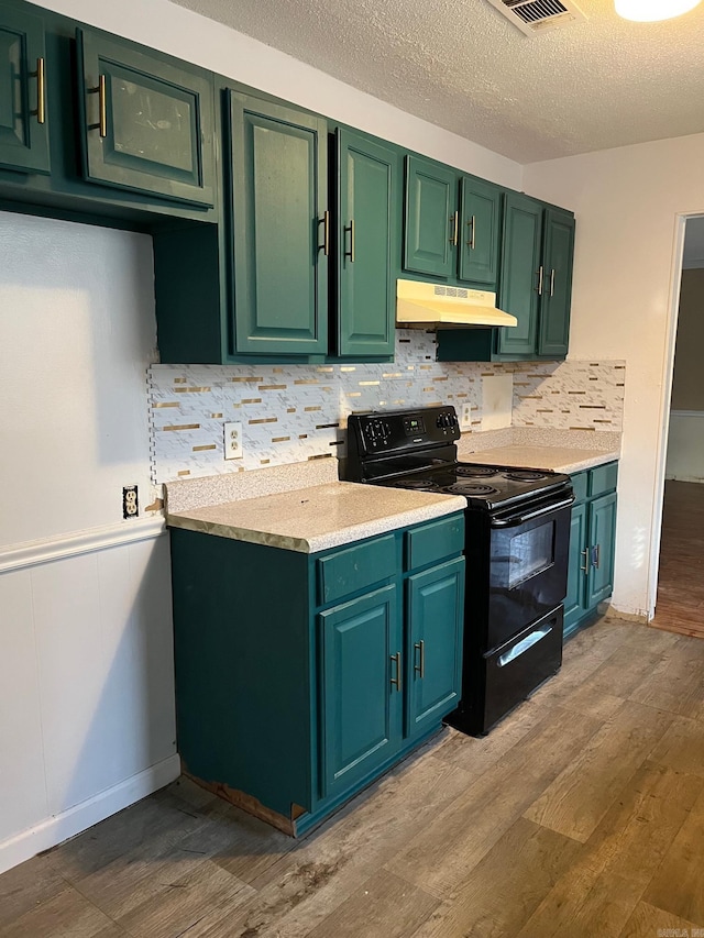 kitchen with light hardwood / wood-style flooring, green cabinets, backsplash, a textured ceiling, and black range with electric cooktop