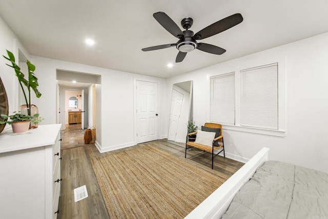 bedroom with ceiling fan and light wood-type flooring