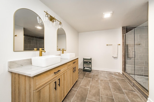 bathroom with walk in shower and vanity