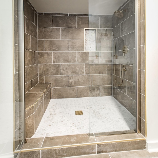 bathroom with tiled shower