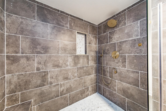 interior space featuring a tile shower