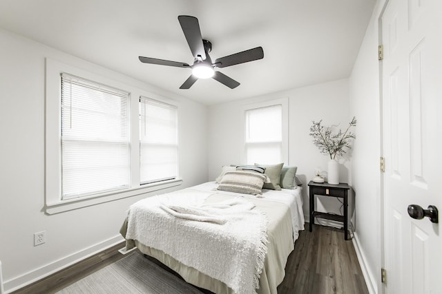 bedroom with dark wood-type flooring and ceiling fan