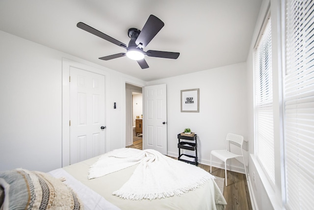 bedroom with hardwood / wood-style flooring and ceiling fan