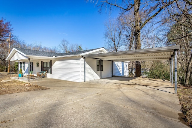 ranch-style home with a carport and a porch