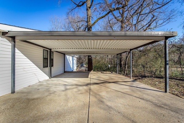 view of vehicle parking with a carport