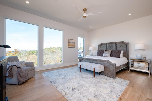 bedroom featuring ceiling fan and light wood-type flooring