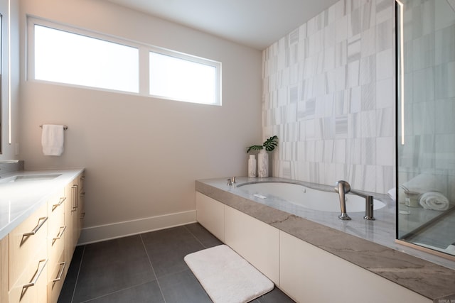 bathroom featuring plus walk in shower, tile patterned floors, and vanity