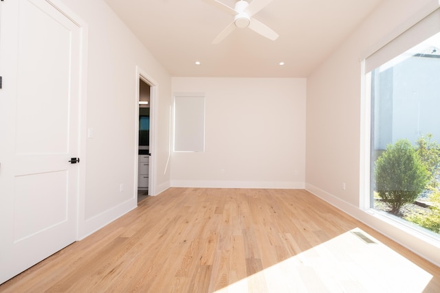 spare room with ceiling fan and light hardwood / wood-style flooring