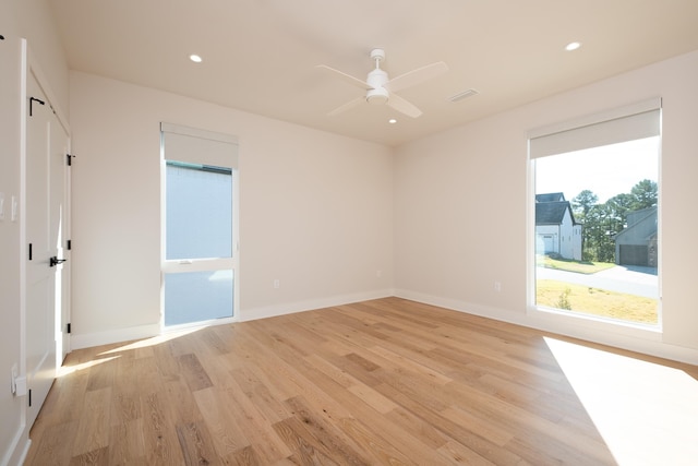 unfurnished room with ceiling fan and light hardwood / wood-style flooring