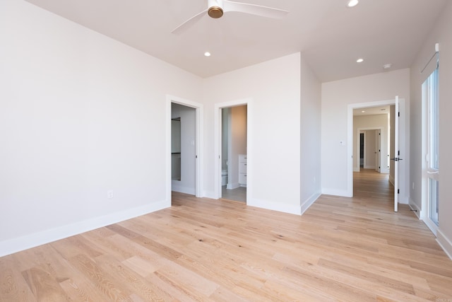 spare room featuring ceiling fan and light hardwood / wood-style floors