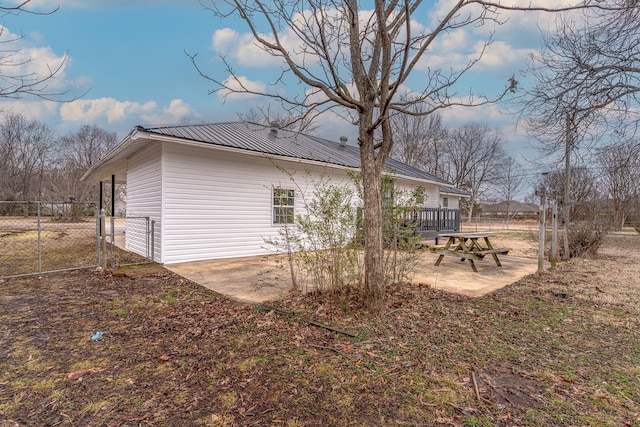 view of property exterior featuring a patio area