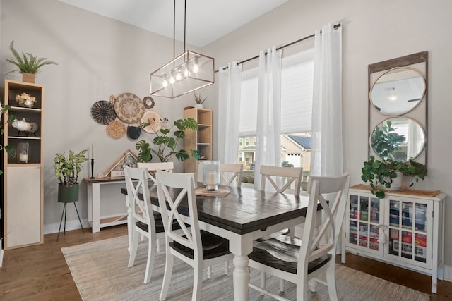 dining area featuring dark hardwood / wood-style flooring