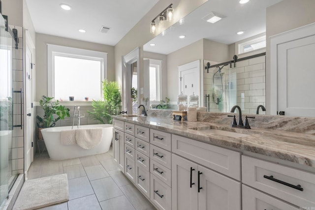 bathroom featuring vanity, tile patterned floors, and plus walk in shower